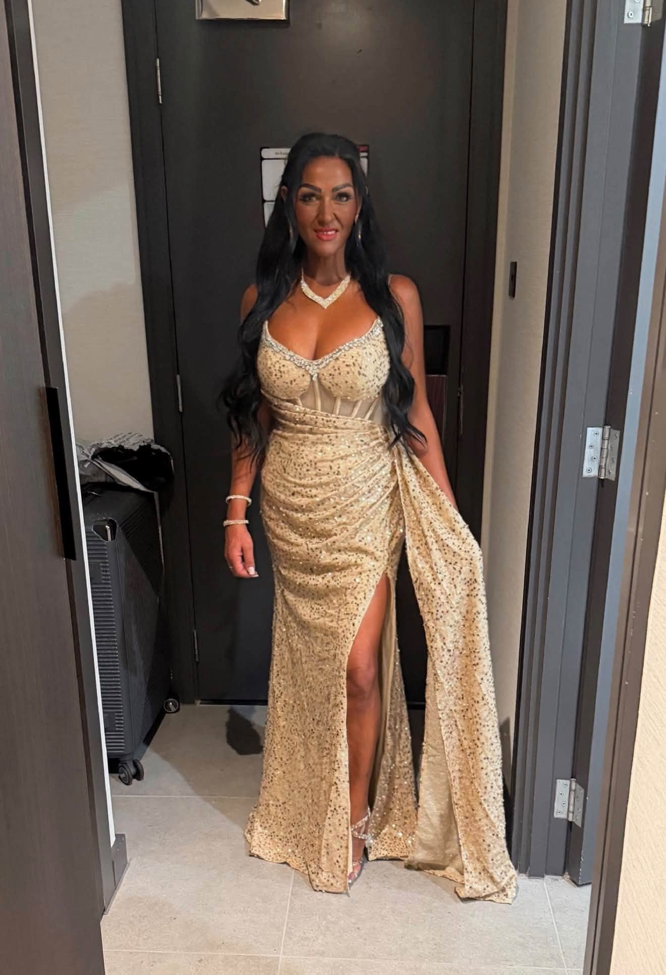 Lisa James in a gold sequinned gown on an awards night